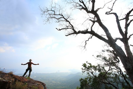 Emotional boy under the treeの写真素材