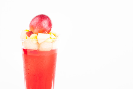 strawberry jelly with fruit salad on white paper backgroundの写真素材