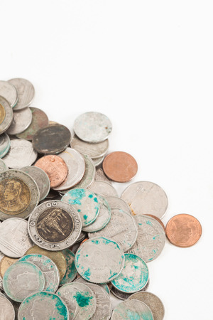 dirty thai coins on white backgroundの写真素材