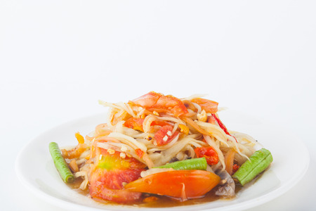 papaya salad on dish with white paper backgroundの写真素材