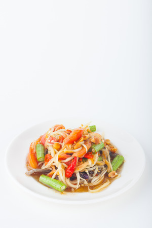 papaya salad on dish with white paper backgroundの写真素材