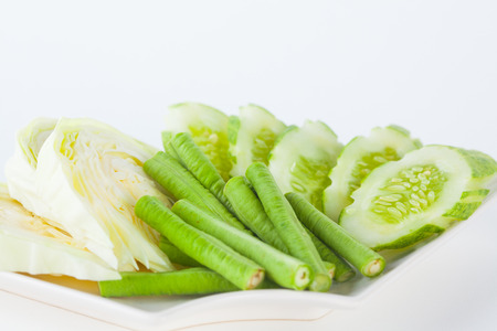 Vegetable side dishes on white paper backgroundの写真素材
