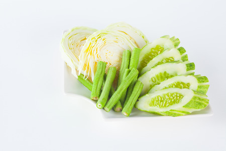 Vegetable side dishes on white paper backgroundの写真素材
