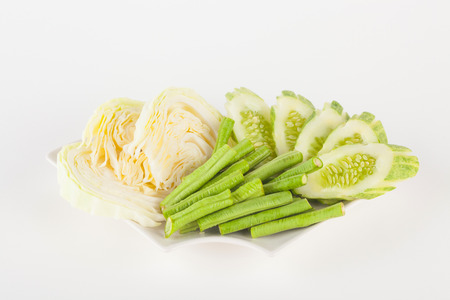 Vegetable side dishes on white paper backgroundの写真素材