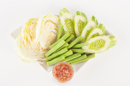chili paste and vegetable side dishes on white paper backgroundの写真素材