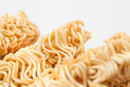 A block of dried Instant noodles on gray background paper