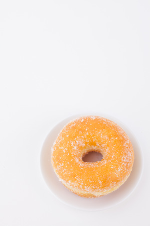 Delicious Sugar Ring Donut with a White paper Backgroundの写真素材