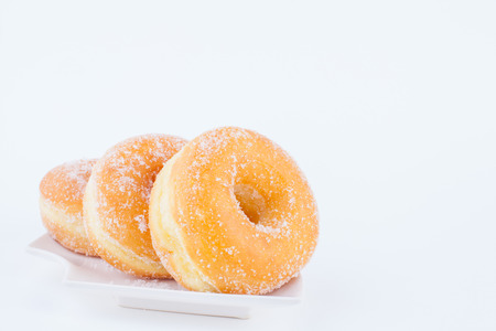 Delicious Sugar Ring Donut with a White paper Backgroundの写真素材