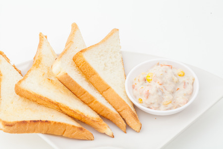 bread sandwich with tuna fish on white paper backgroundの写真素材