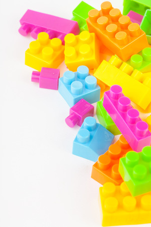 Toy building colorful blocks on white paper backgroundの写真素材
