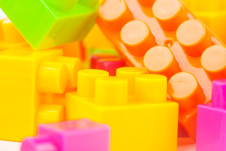 Toy building colorful blocks on white paper backgroundの写真素材