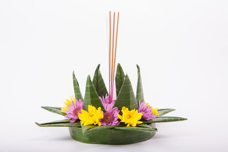 Krathong, the hand crafted floating candle made of floating part decorated with green leaves colorful flowers and many sorts of creative materials .の写真素材