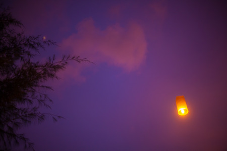 Floating lanterns in the evening sky at Thailandの写真素材