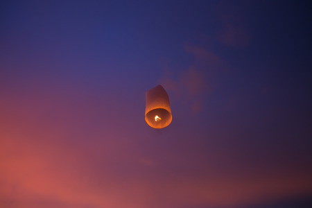 Floating lanterns in the evening sky at Thailandの写真素材