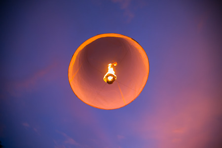 Floating lanterns in the evening sky at Thailandの写真素材