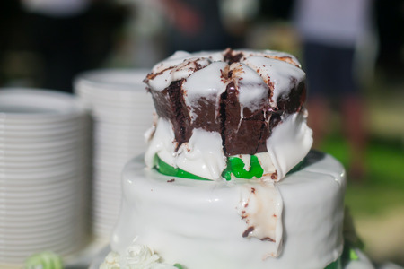 White wedding cake with real roses decorations