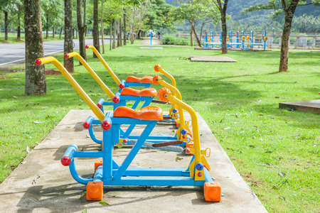Exercise equipment in public park in the morning at Thailandの写真素材