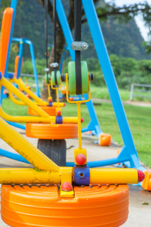 Exercise equipment in public park in the morning at Thailandの写真素材