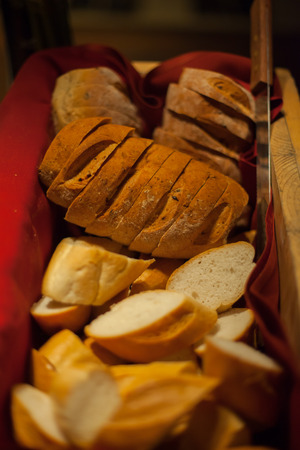 Bread basket with loaf and buns set for wedding dinner partyの写真素材