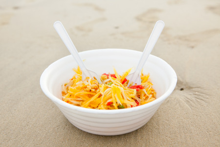 Thai papaya salad serve at the beachの写真素材