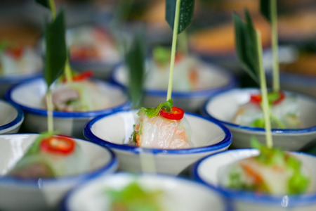 canape with fresh spring rolls set for wedding ceremonyの写真素材