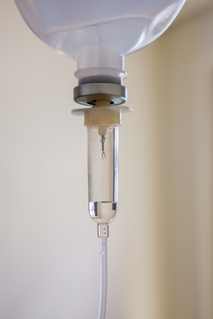 saline solution IV at hospital room in morningの写真素材
