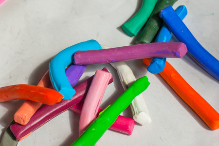 Colorful plasticine on old paper in the house.の写真素材