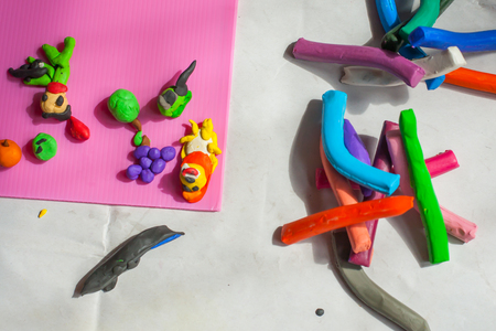 Colorful plasticine on old paper in the house.の写真素材