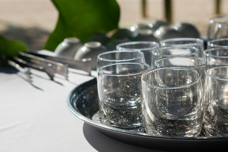 Empty glasses composition on table before celebration at outdoorの写真素材