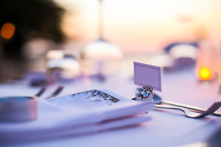 Romantic set up dinner set on the beach.(Selactive focus)の写真素材