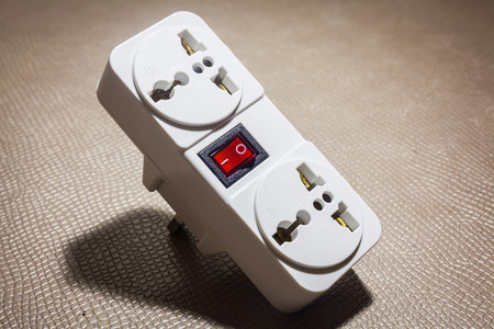Electrical socket plug adapter put on the  table  background .