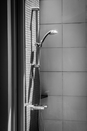 Shower with running water (Black and white)の写真素材