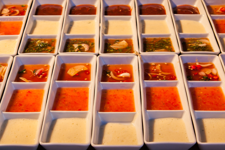 Different type of sauces on buffet line.