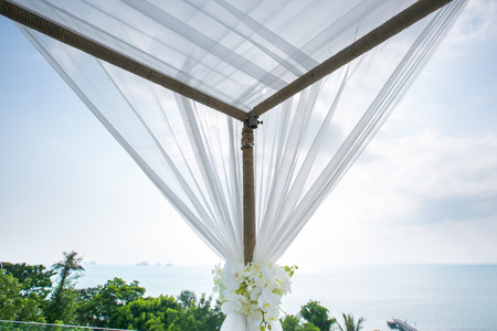 wedding setup detail  closeup of beautiful wedding decorated on wedding archの写真素材