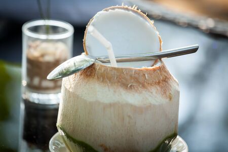 Coconut water is placed on the table and refreshment.の写真素材