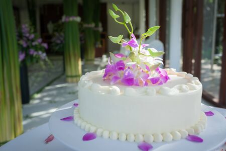 Beautiful Wedding Cake with Orchids on top.の写真素材