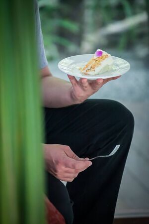Guests attending the wedding Eat Wedding Cake with bride and groom.の写真素材