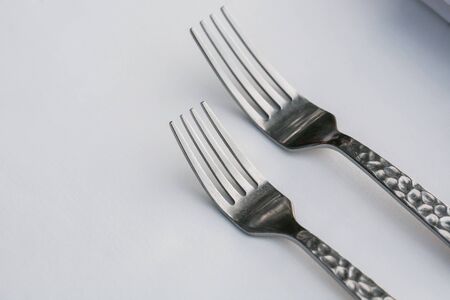 Dinner set. Fork, knife and spoon on the tableの写真素材