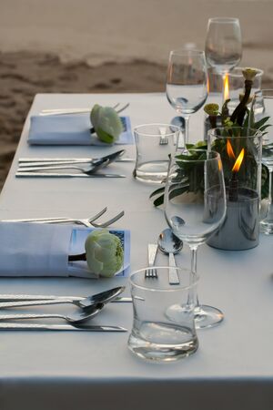 dinner table on the beach at Thailandの写真素材