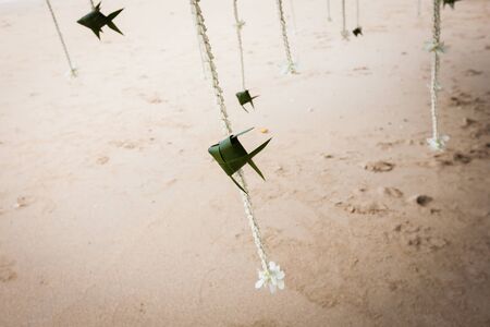 Floral arrangement at a wedding ceremony on beach.の写真素材