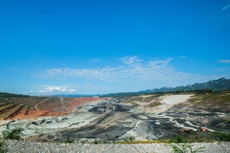 Mining dump trucks working in coalmine , Used as a source of electricity generation in the country.