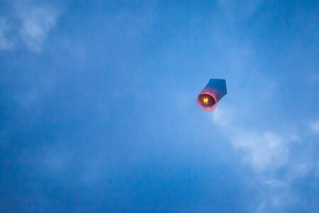 Floating lanterns in the evening sky at Thailandの写真素材