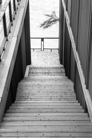 Wooden staircase access to private sandy beach.の写真素材