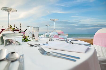 Set the table for dinner on the beach.の写真素材
