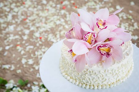Beautiful of  Wedding Cake with Flowers on Top.の写真素材