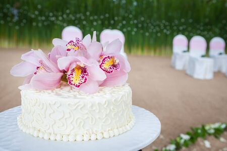 Beautiful of  Wedding Cake with Flowers on Top.の写真素材