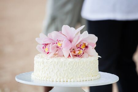 Beautiful of  Wedding Cake with Flowers on Top.の写真素材