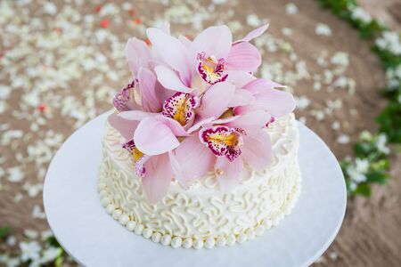 Beautiful of  Wedding Cake with Flowers on Top.の写真素材