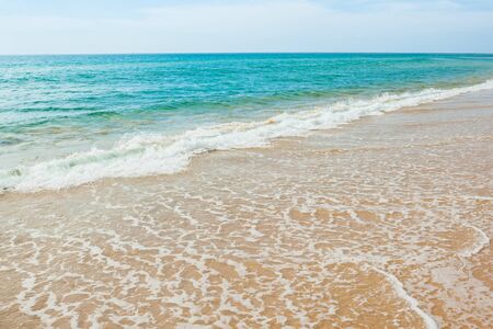 Wave of the sea on the sand beach at Thailand.の写真素材