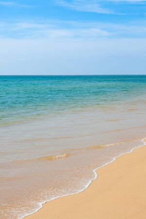 Wave of the sea on the sand beach at Thailand.の写真素材